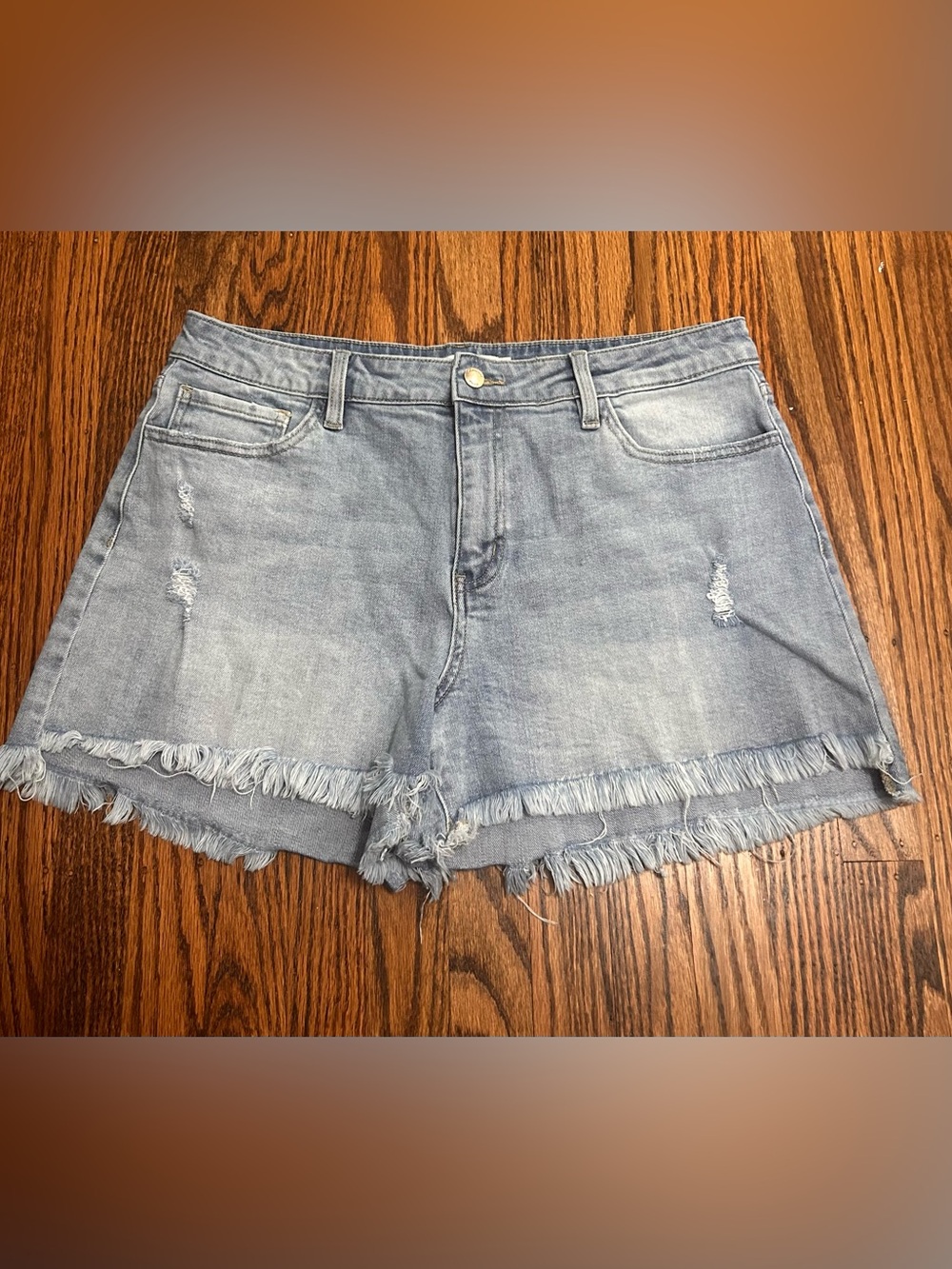 Distressed light denim shorts